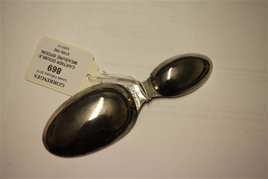 A 20th century Cartier sterling silver travelling double measure folding spoon, 5.25in (open).